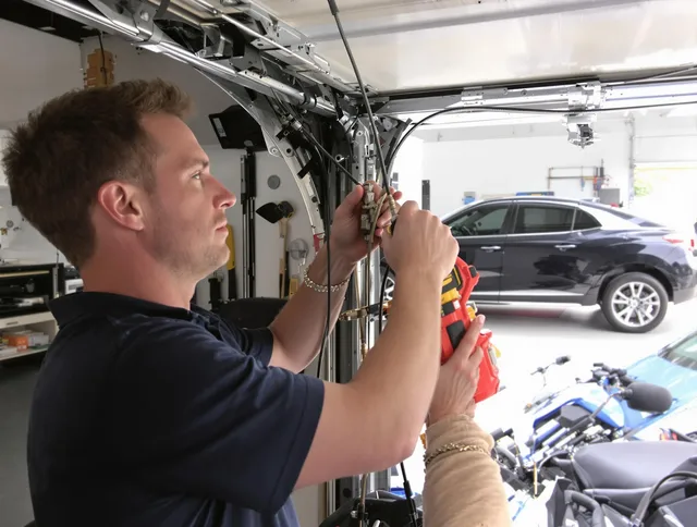 West Hollywood Garage Door Repair safety certified technician performing cable replacement in West Hollywood