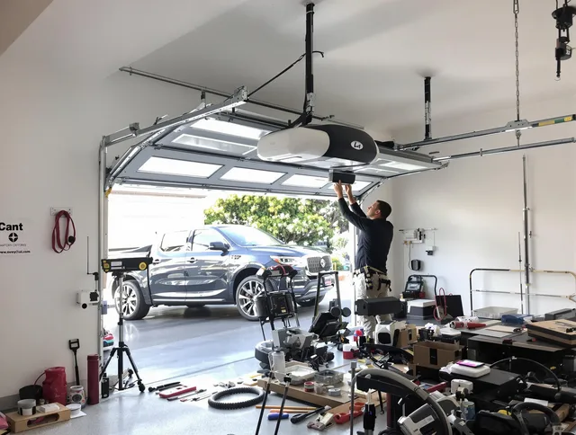 West Hollywood Garage Door Repair specialist installing smart garage door opener system in West Hollywood home